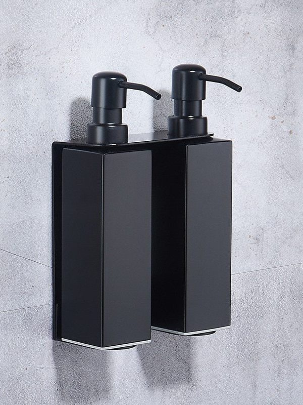 Press the wall-mounted soap dispenser