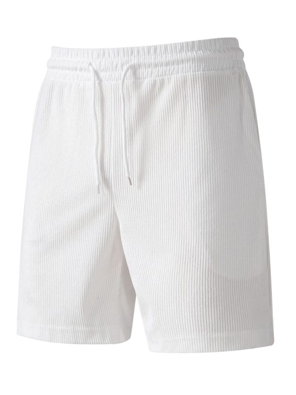 شورت رياضي فضفاض برباط من قماش الكوردروي بلون موحد للرجال